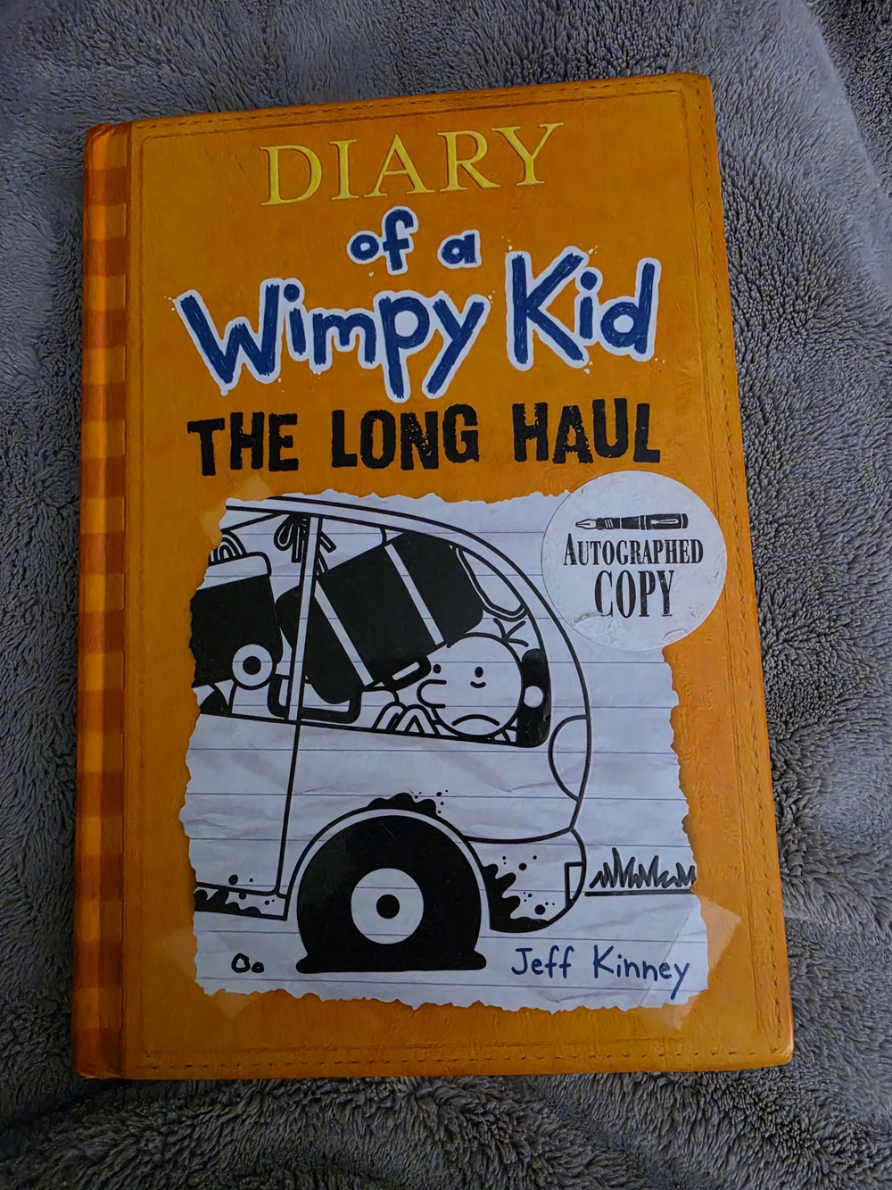 autographed hardcover copy of Diary of a Wimpy Kid: The Long Haul (Book 9)